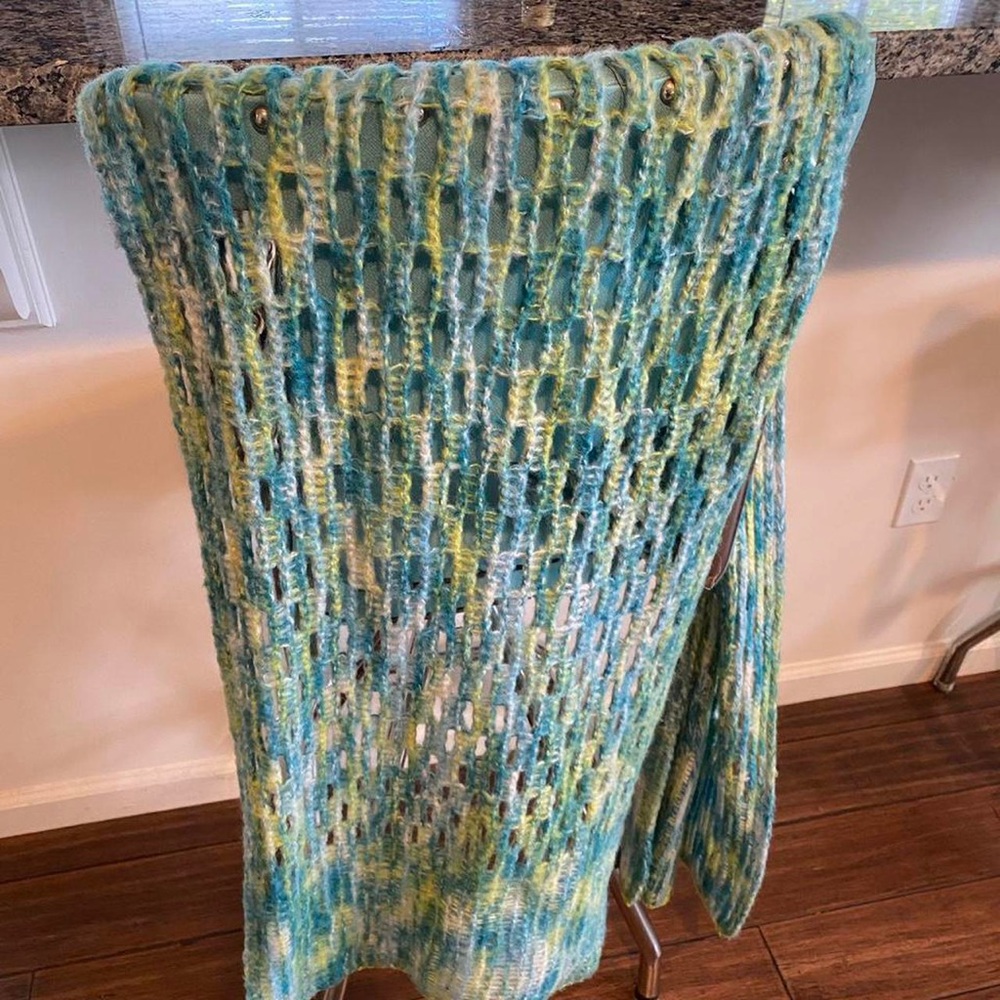 Warm knit scarf 68” long x 14” wide. 100% acrylic yarn.